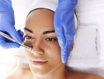 A woman getting a facial skin treatment